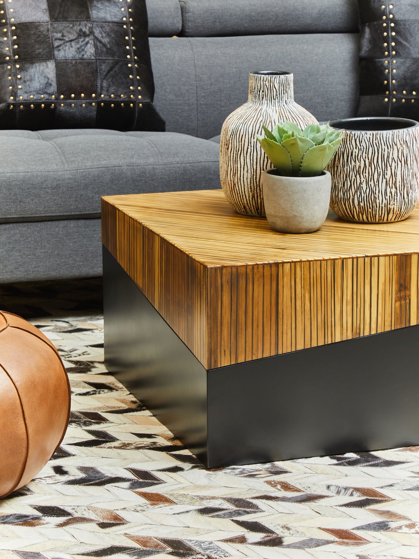 Natural bamboo rectangular coffee table with an ebony finish base and clean sides in two tonal contrast.