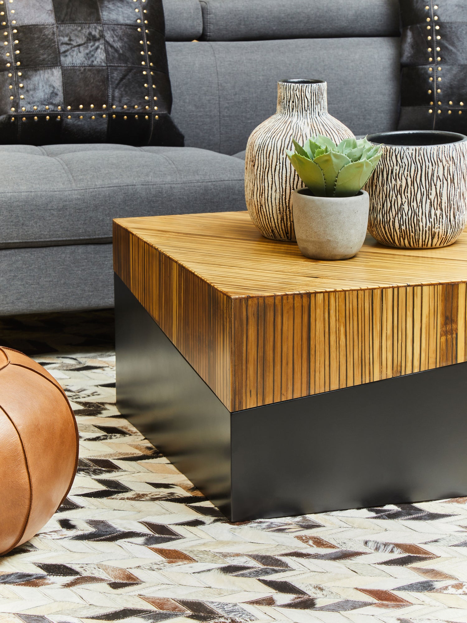 Natural bamboo rectangular coffee table with an ebony finish base and clean sides in two tonal contrast.
