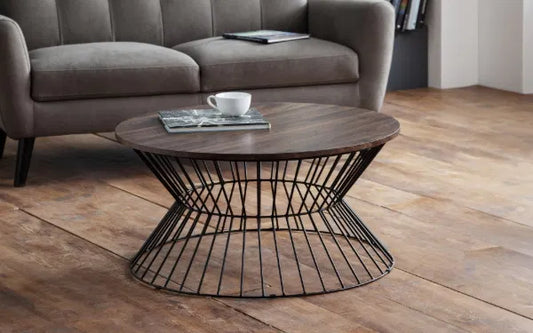 Wooden coffee table with metal base in a living room setting
